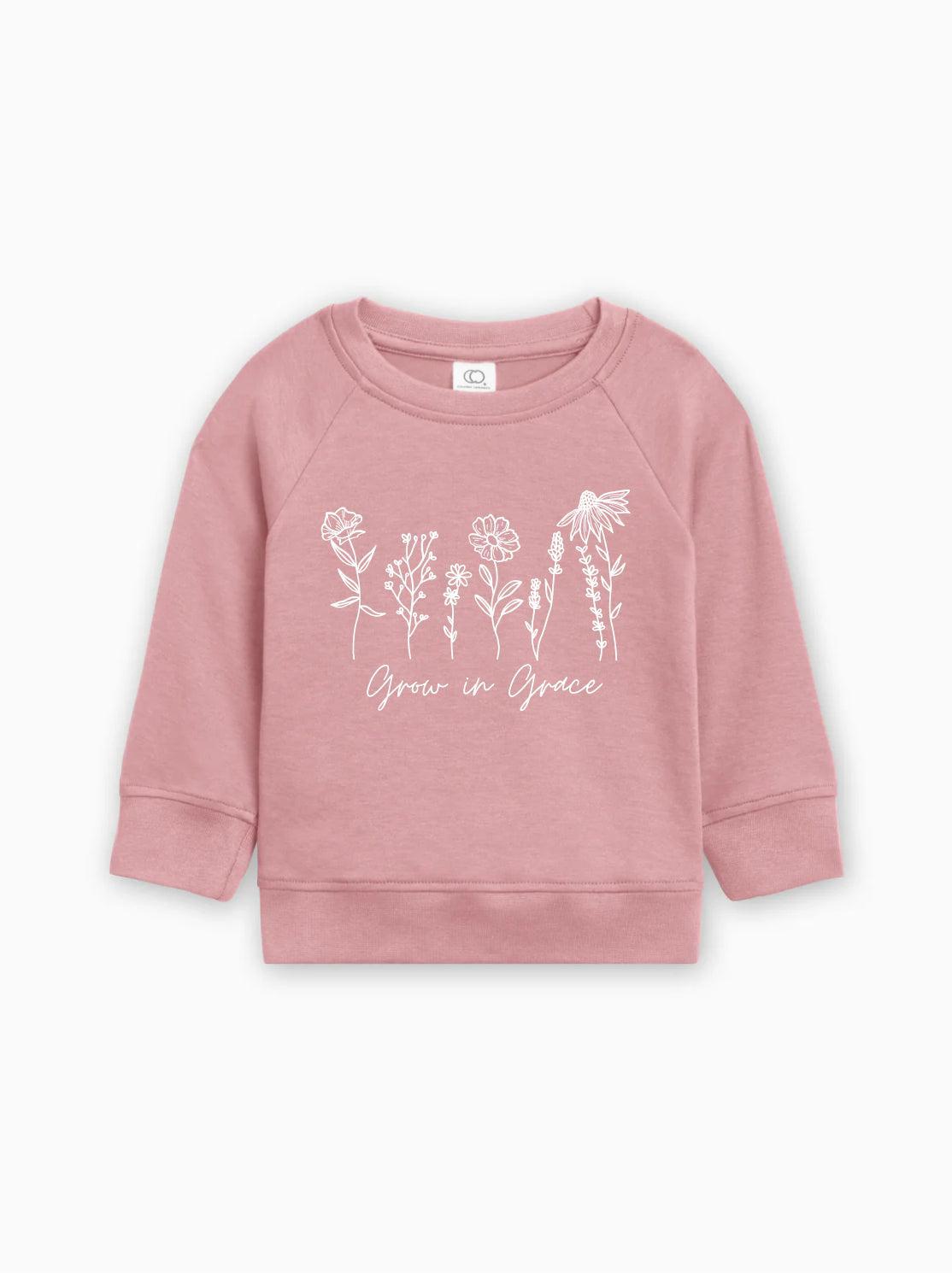 Pink baby pullover with long sleeves and white botanical 'Grow in Grace' print