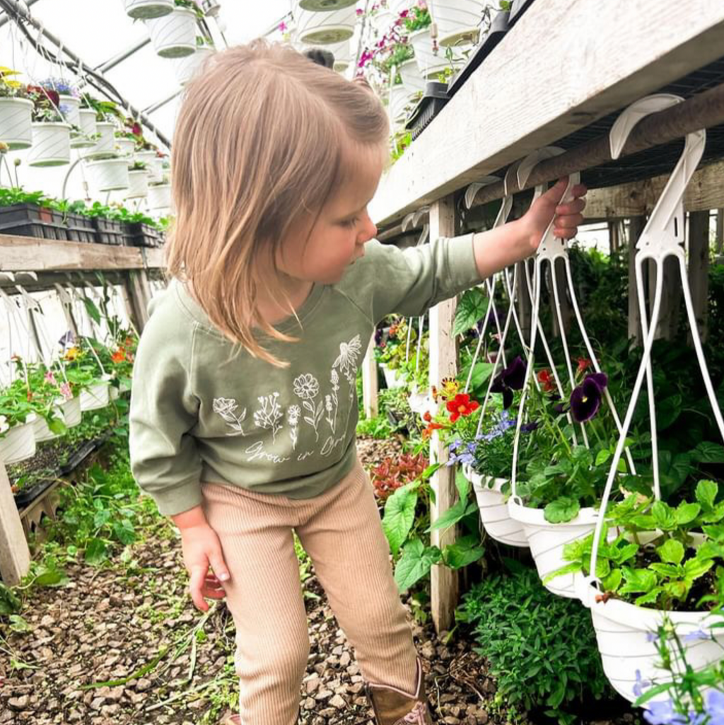 Green baby pullover with long sleeves and white botanical 'Grow in Grace' print