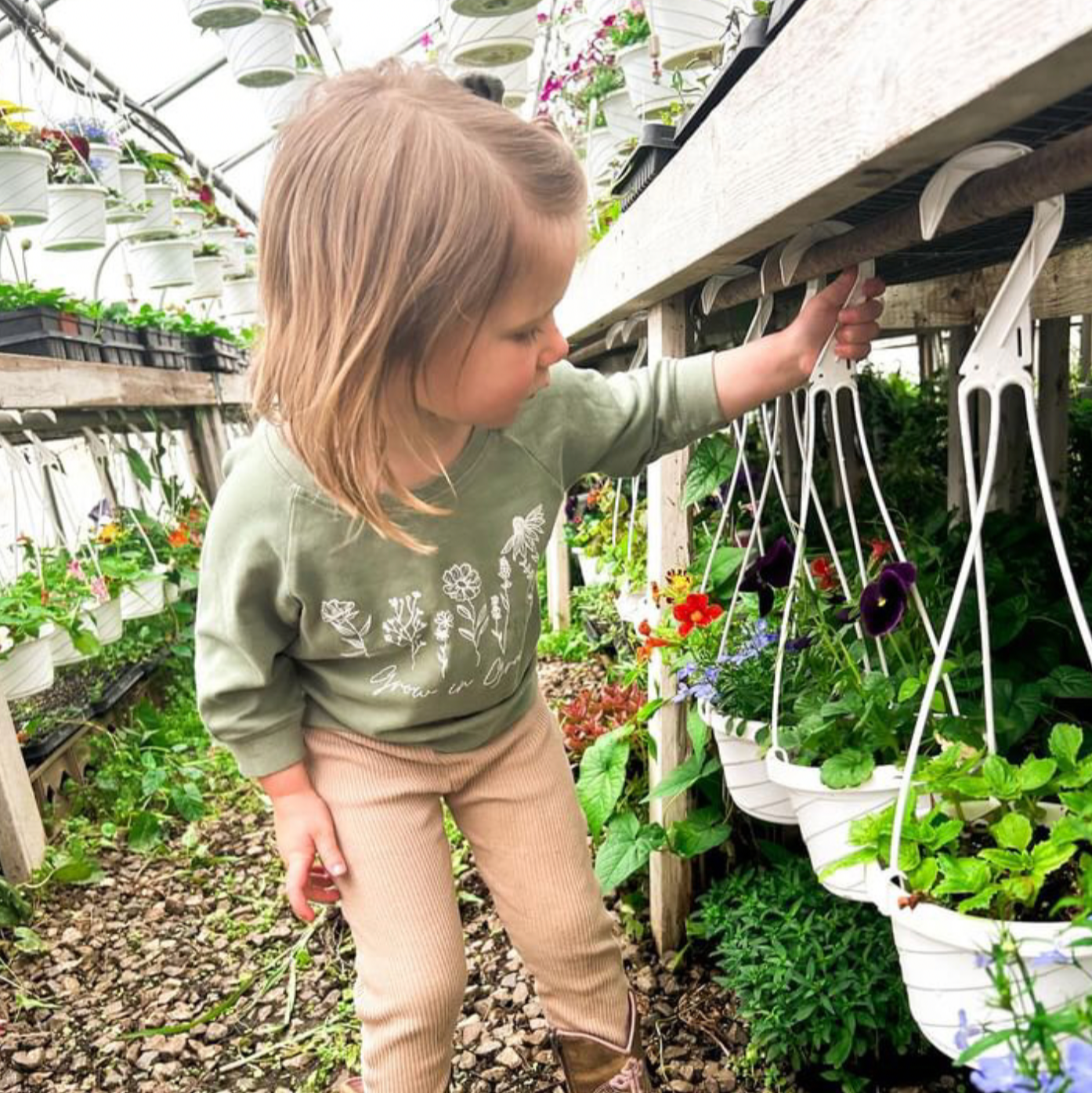 Green baby pullover with long sleeves and white botanical 'Grow in Grace' print