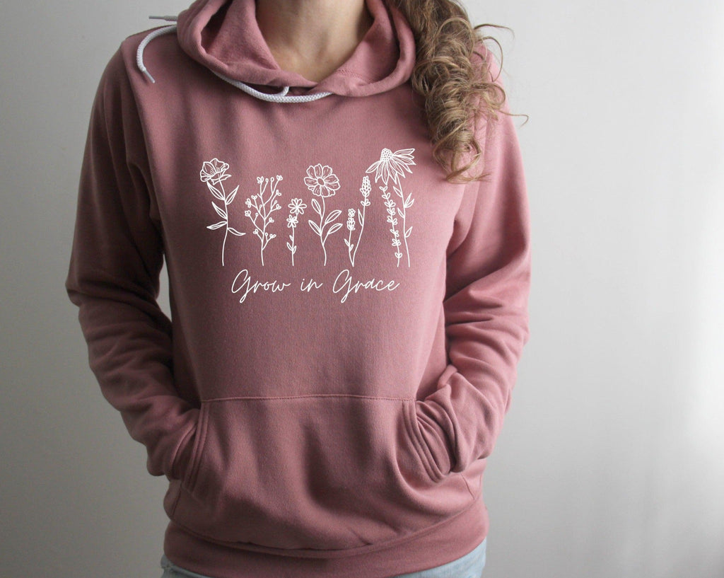 Mauve sponge fleece hoodie with white wildflower “Grow in Grace” graphic