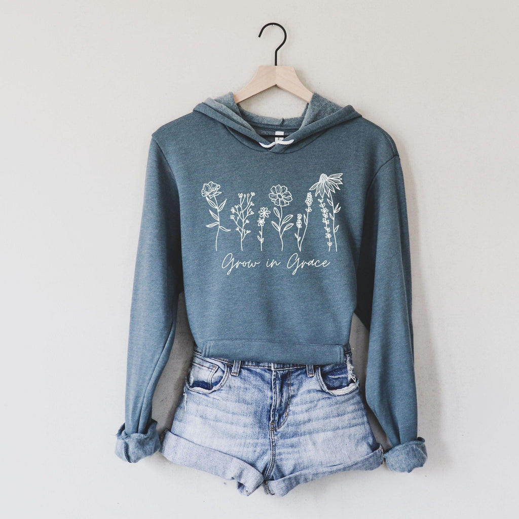 Heather slate sponge fleece hoodie with white wildflower text graphic on front