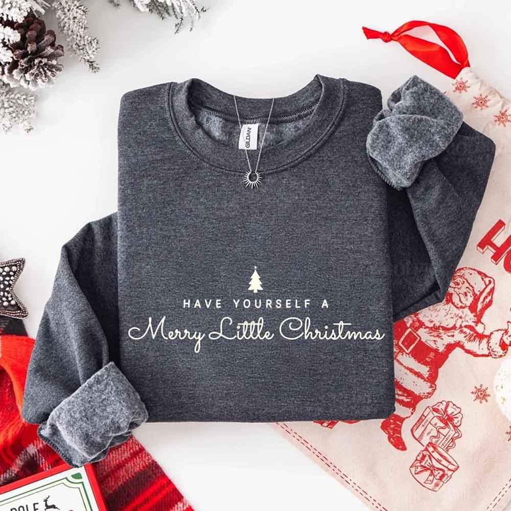 Dark heather grey crew-neck sweatshirt with Merry Little Christmas text and tree graphic