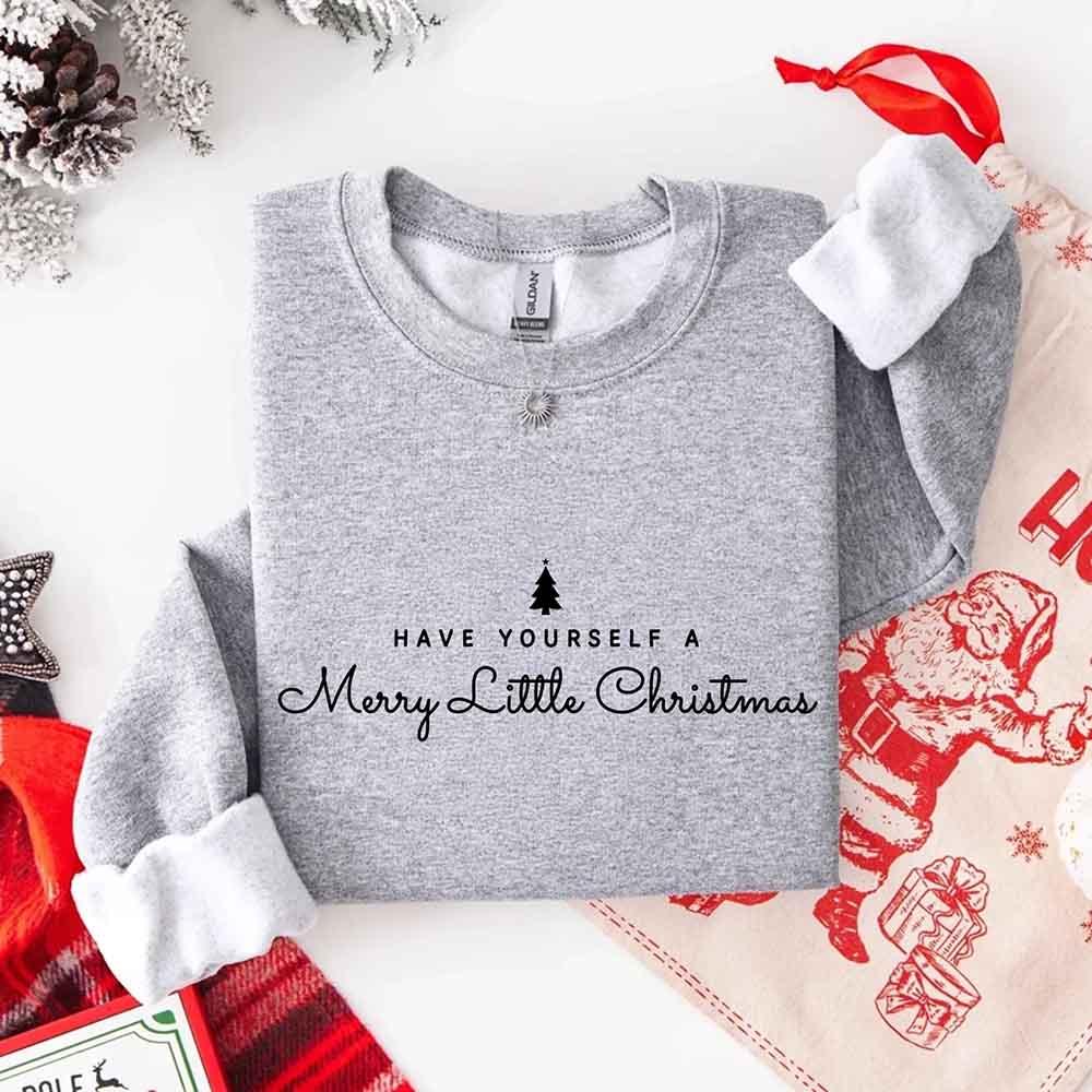 Heather grey crew-neck sweatshirt with Merry Little Christmas text and tree graphic
