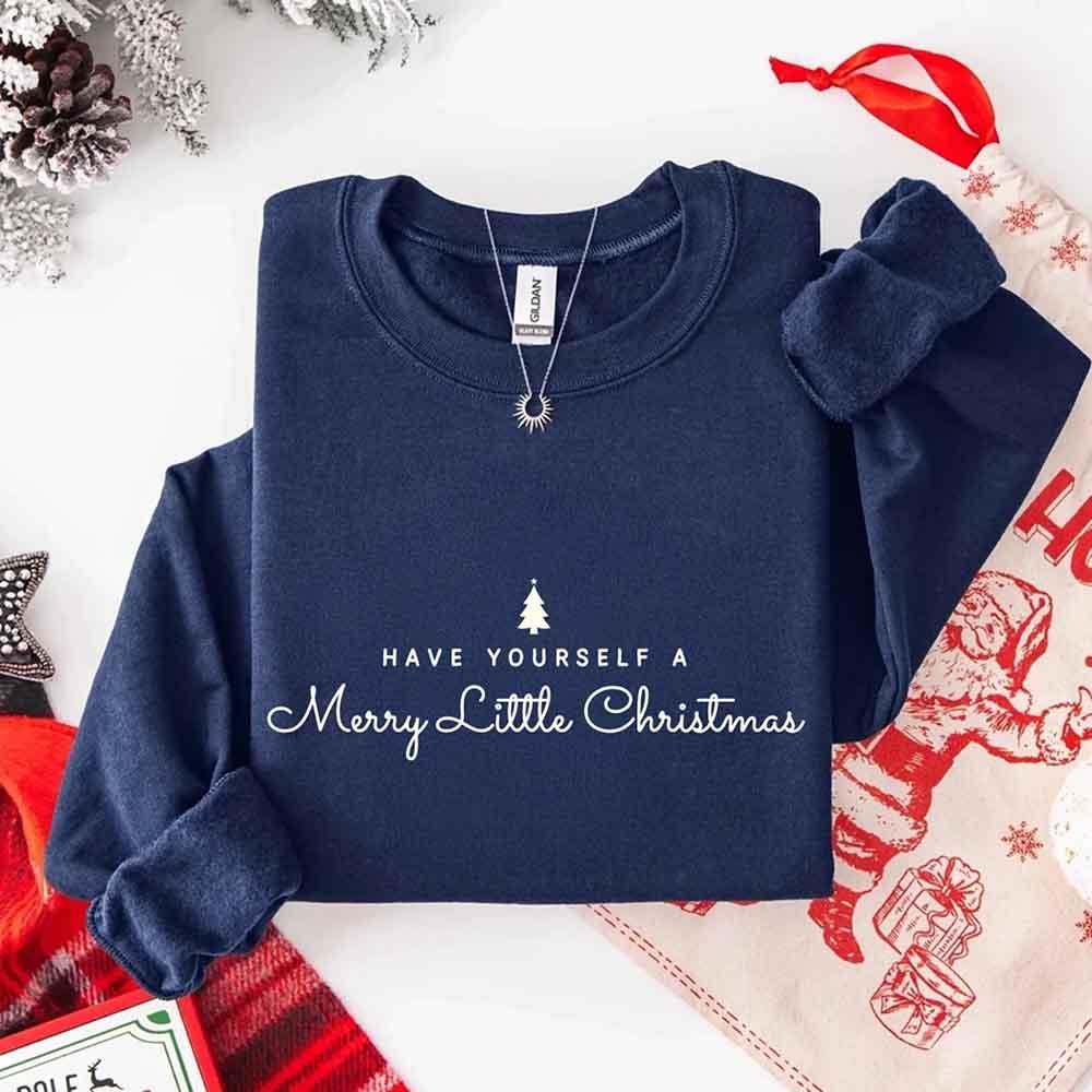 Navy crew-neck sweatshirt with Merry Little Christmas text and tree graphic