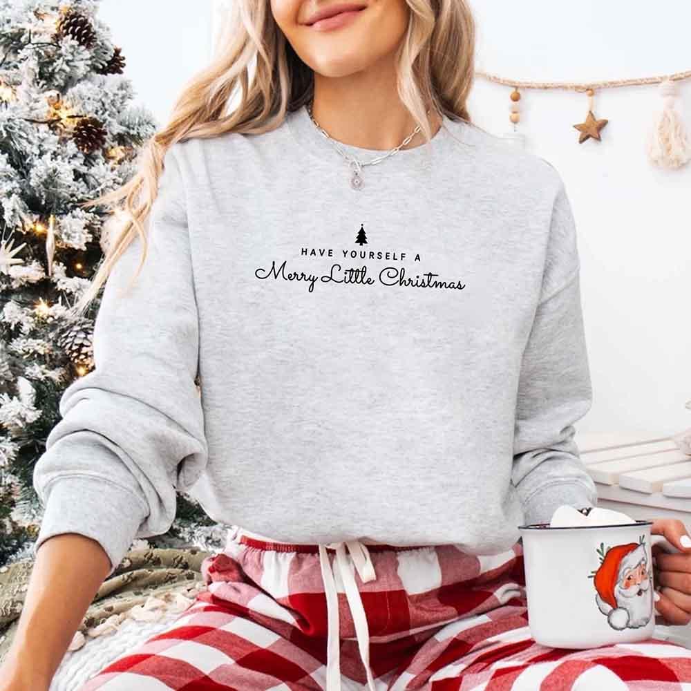 Light grey crew-neck sweatshirt with Merry Little Christmas text and tree graphic