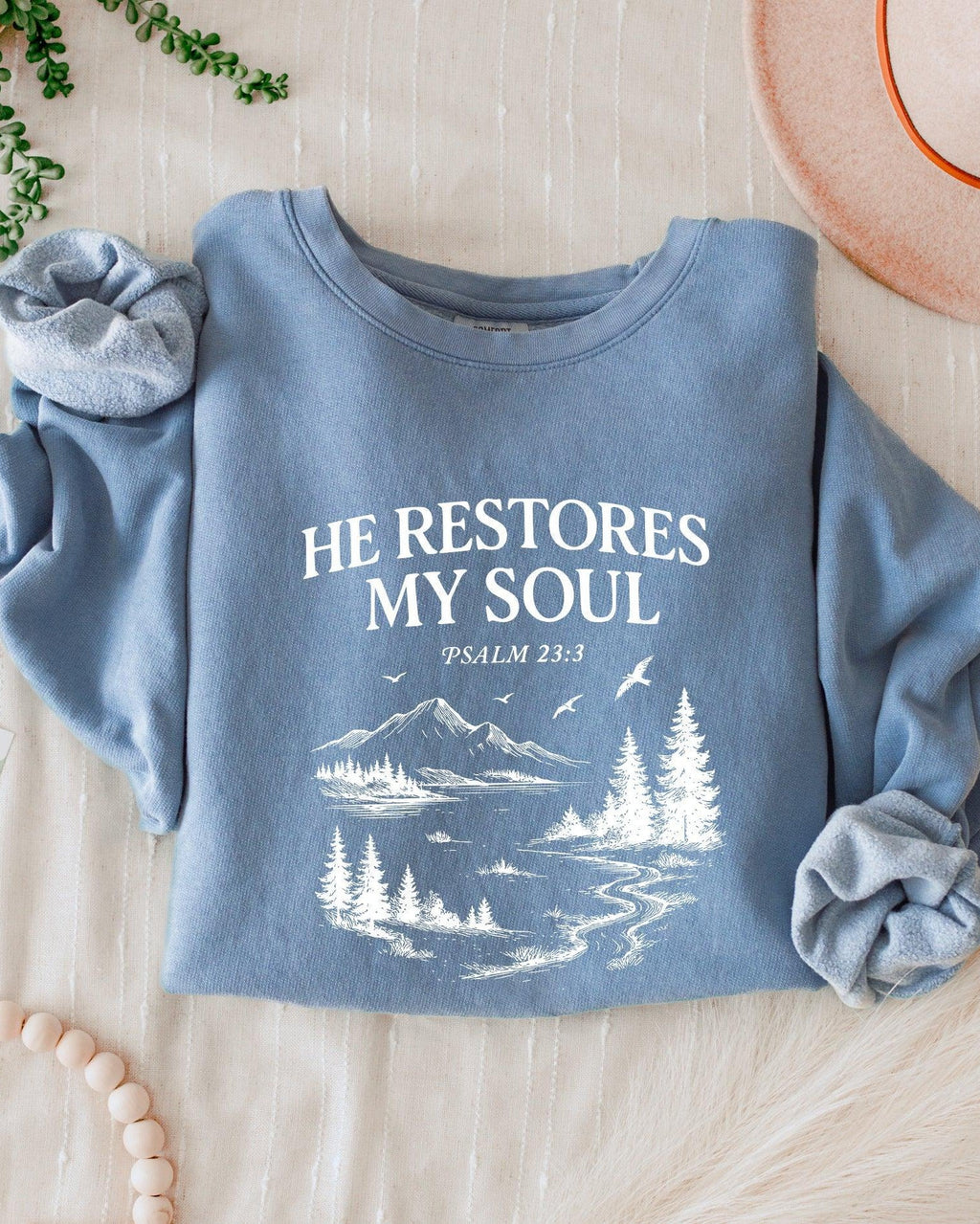 Dyed blue jean sweatshirt with “He Restores My Soul” Psalm 23:3 forest graphic