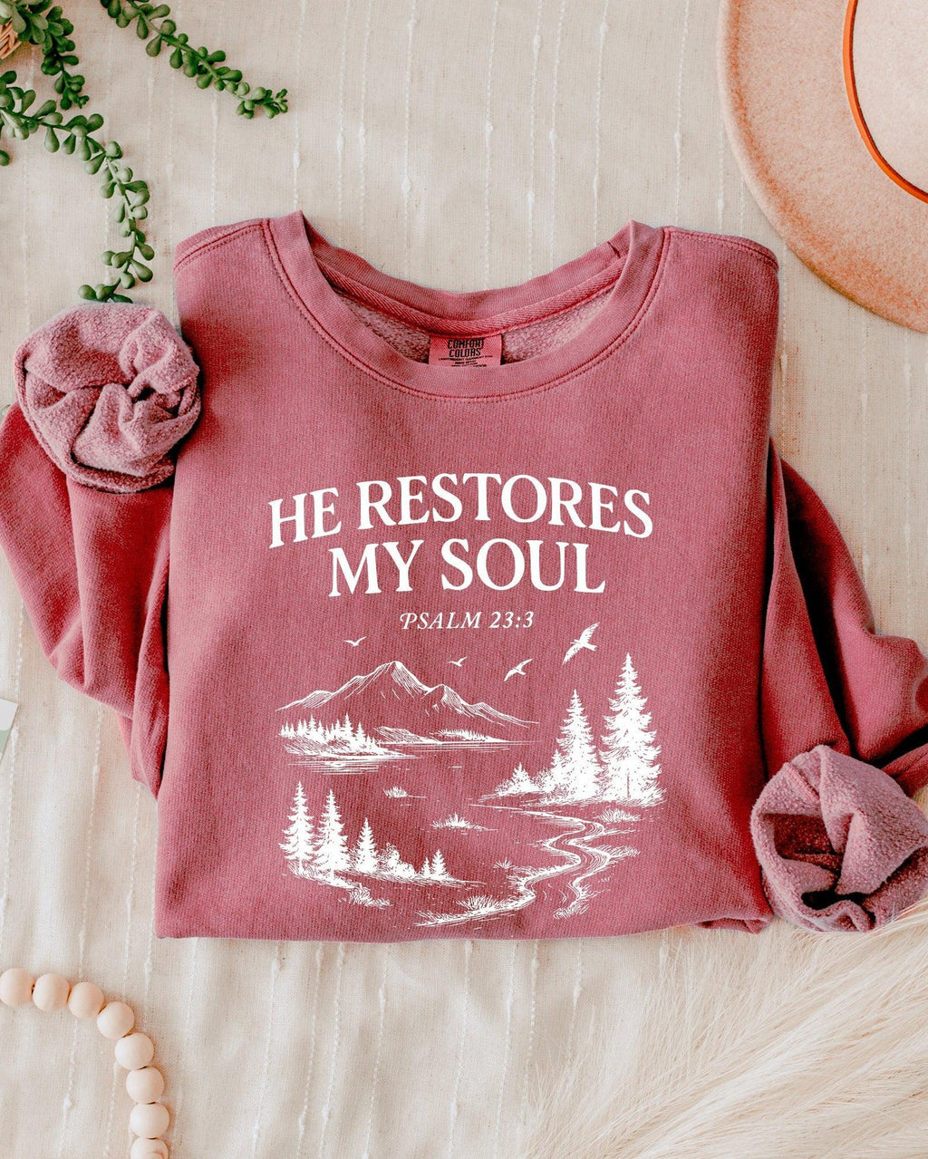 Dyed crimson rose sweatshirt with “He Restores My Soul” Psalm 23:3 forest graphic