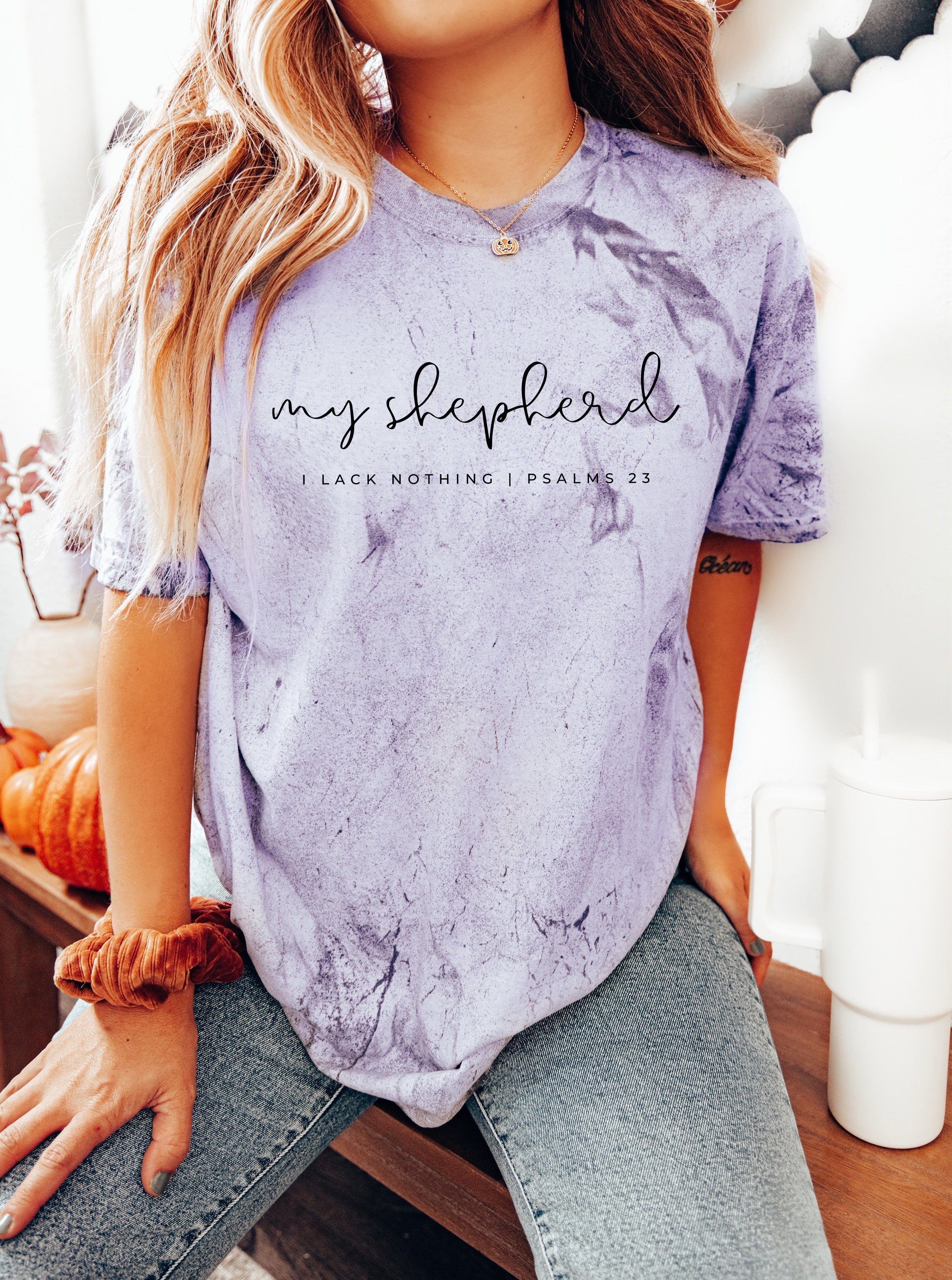 Lavender T-shirt with front script graphic and small text below at the chest