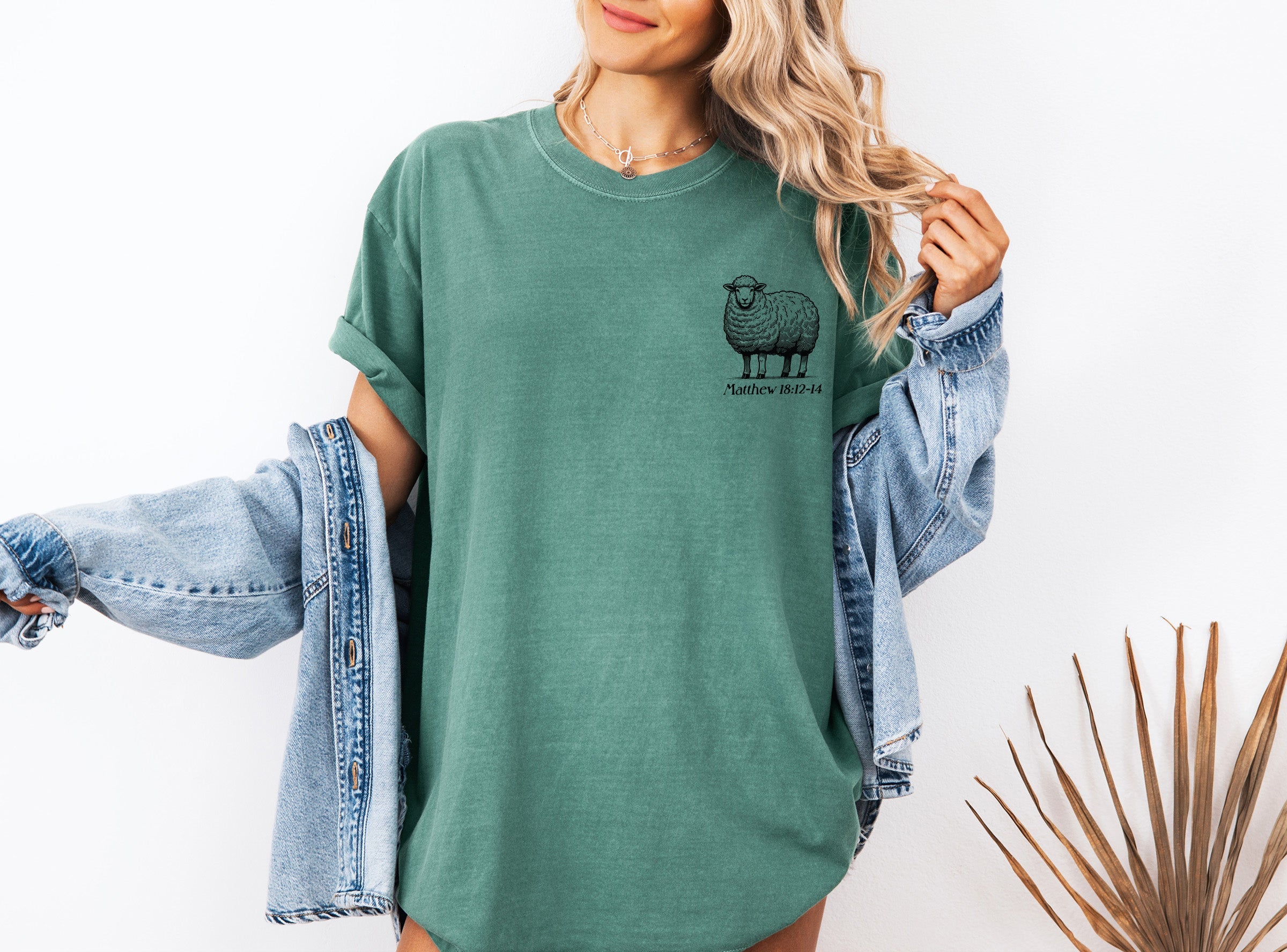 Green unisex graphic T-shirt with sheep logo on chest