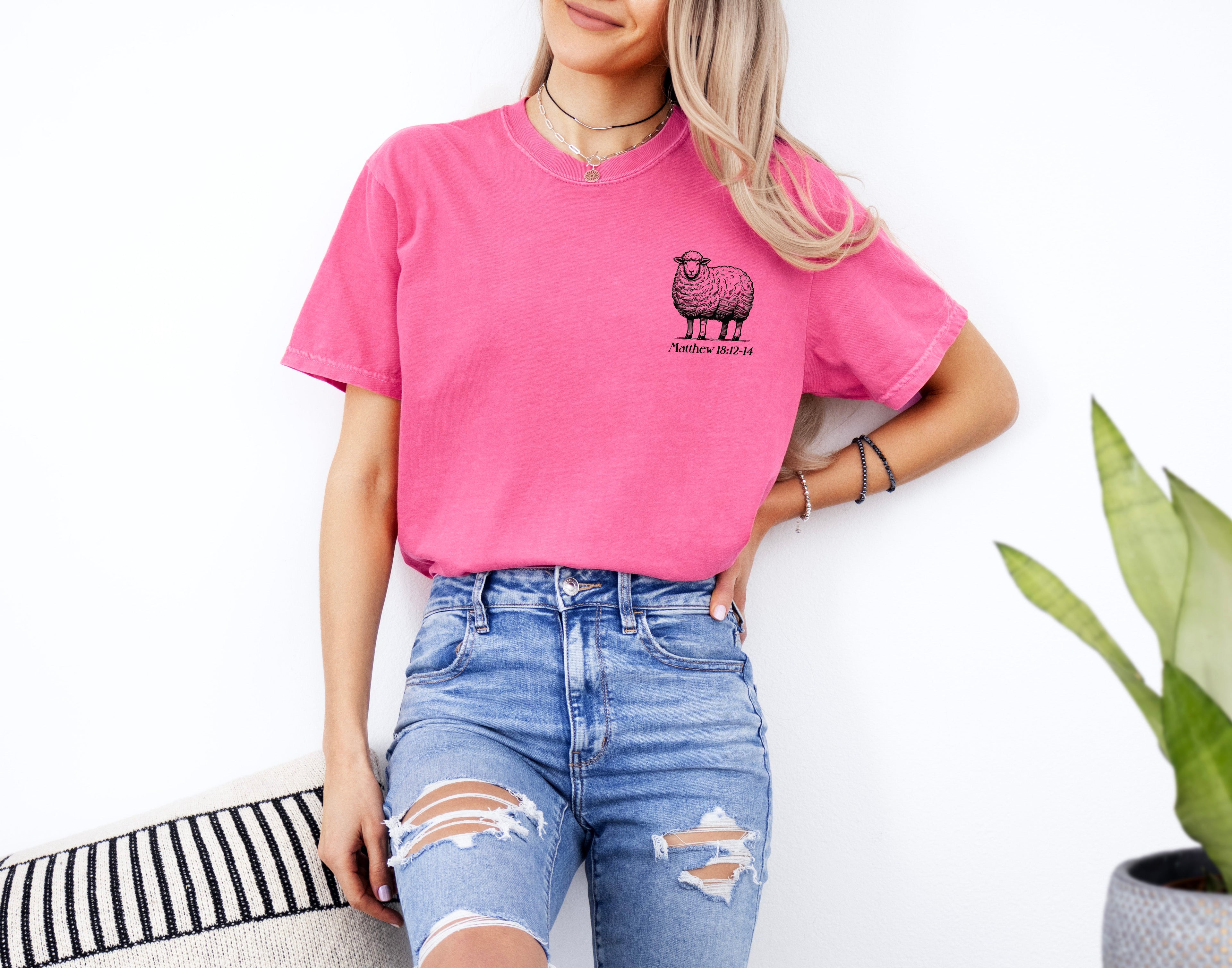 Hot pink garment-dyed T-shirt with sheep graphic at chest