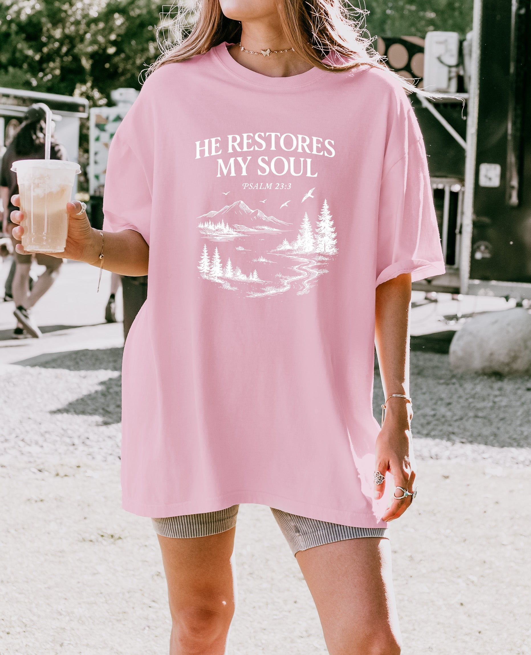 Dusty pink unisex T-shirt with white “He Restores My Soul” mountain graphic, crew neck
