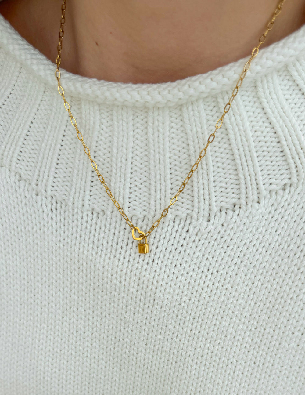 Gold paperclip chain necklace with heart lock pendant
