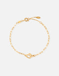Gold paperclip chain bracelet with heart clasp at center