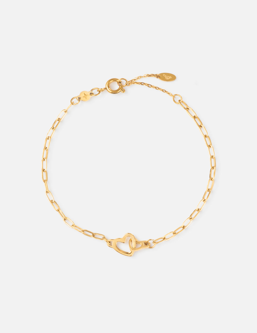 Gold paperclip chain bracelet with heart clasp at center