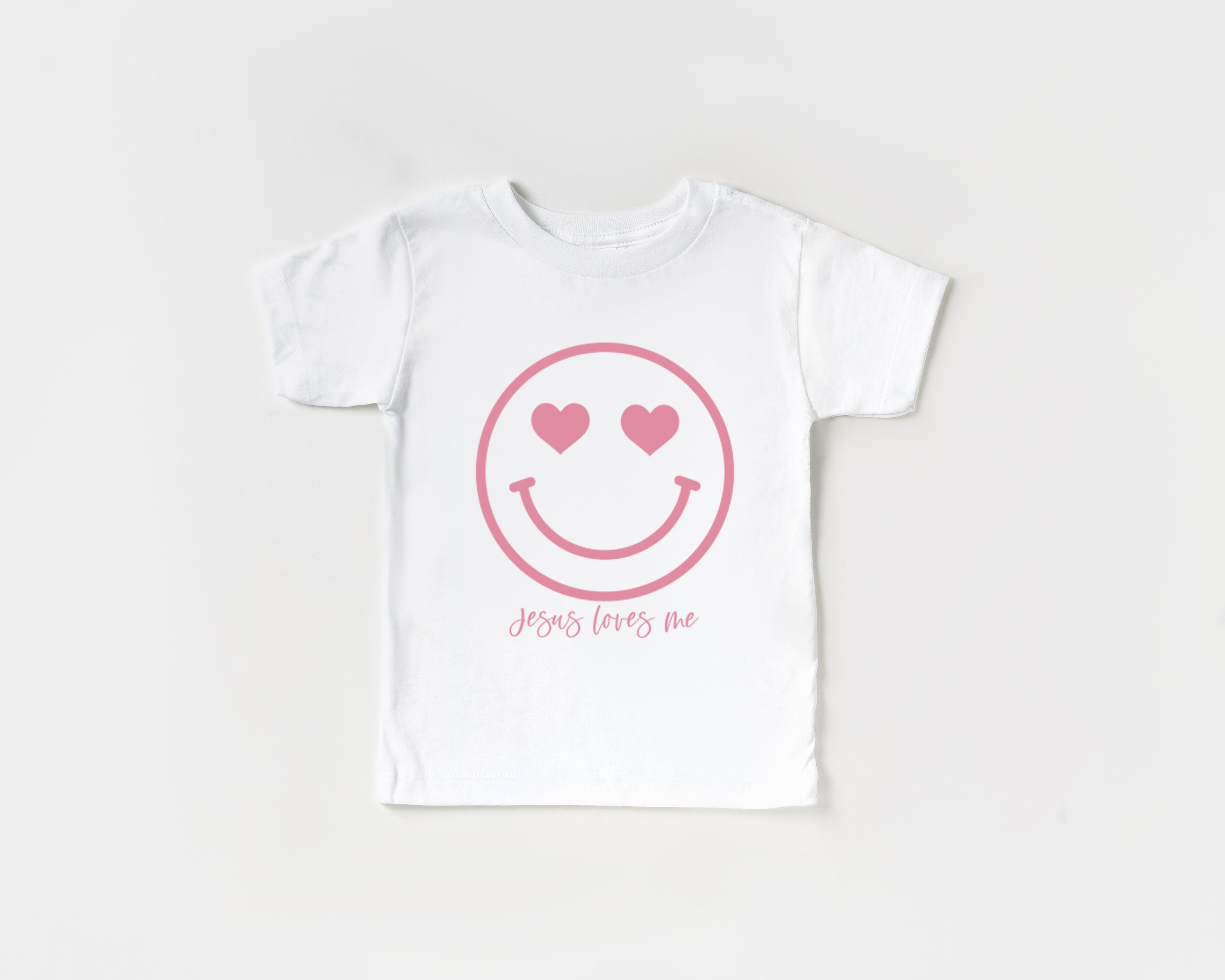 White baby & kids organic cotton tee with pink heart smile graphic