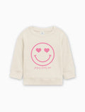 Cream kids organic cotton pullover with pink heart smiley graphic and 'Jesus loves me'