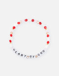 Beaded bracelet with red beads and white letter charms spelling HEART OF GOD