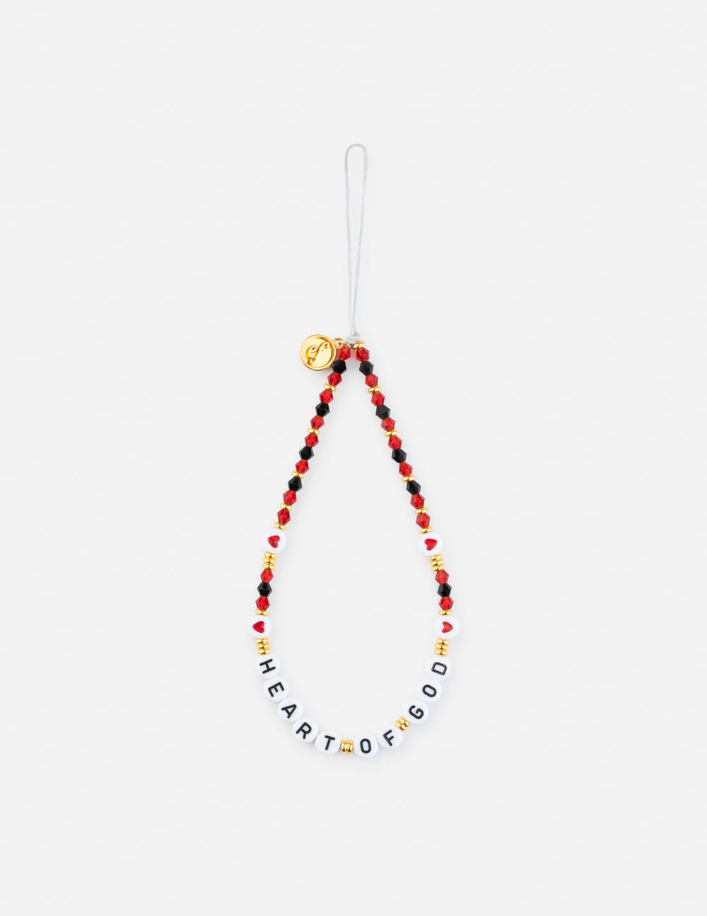Beaded phone charm hanging from string, red and white letter beads with gold charm
