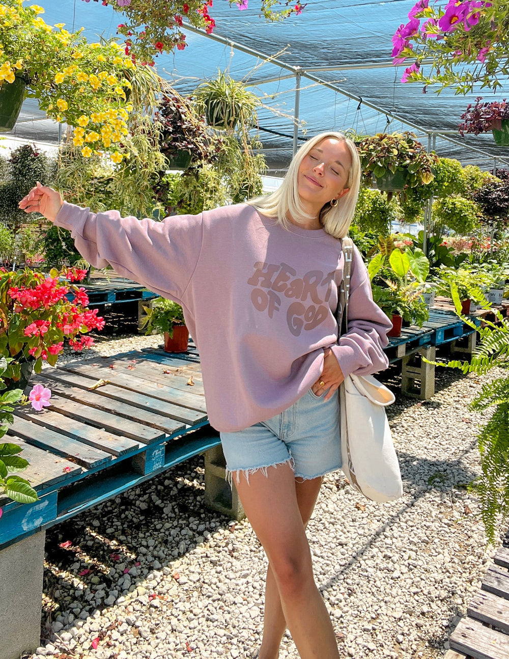 Mauve unisex crewneck sweatshirt with Heart of God front graphic, relaxed fit