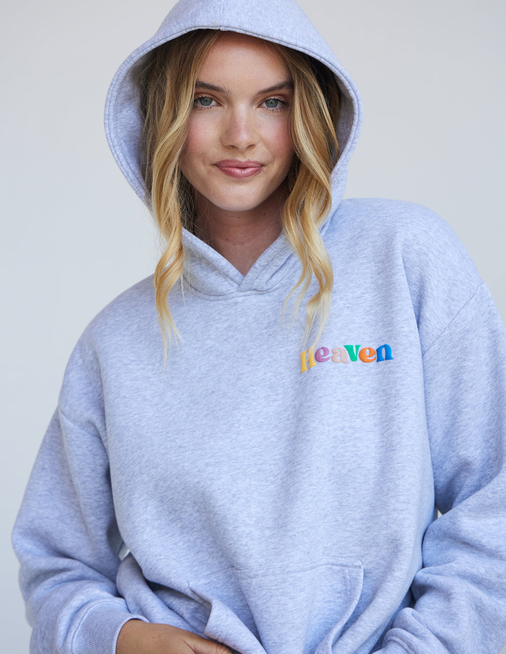 Heather grey unisex hoodie with hood, kangaroo pocket, and Heaven logo on chest
