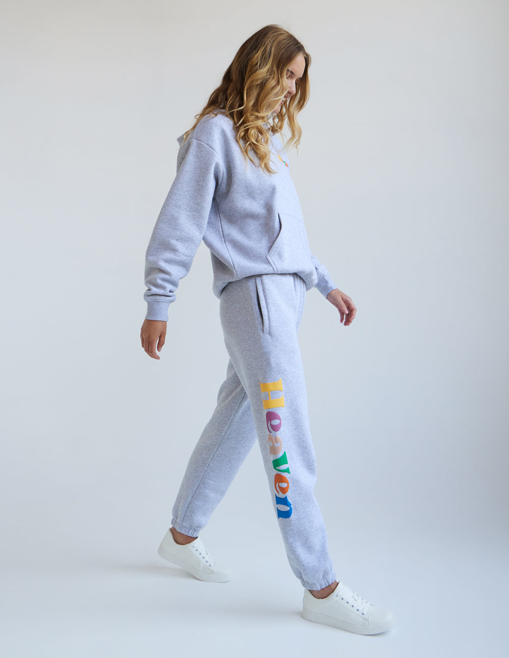 Heather grey unisex hoodie with hood and kangaroo pocket, shown in a side view