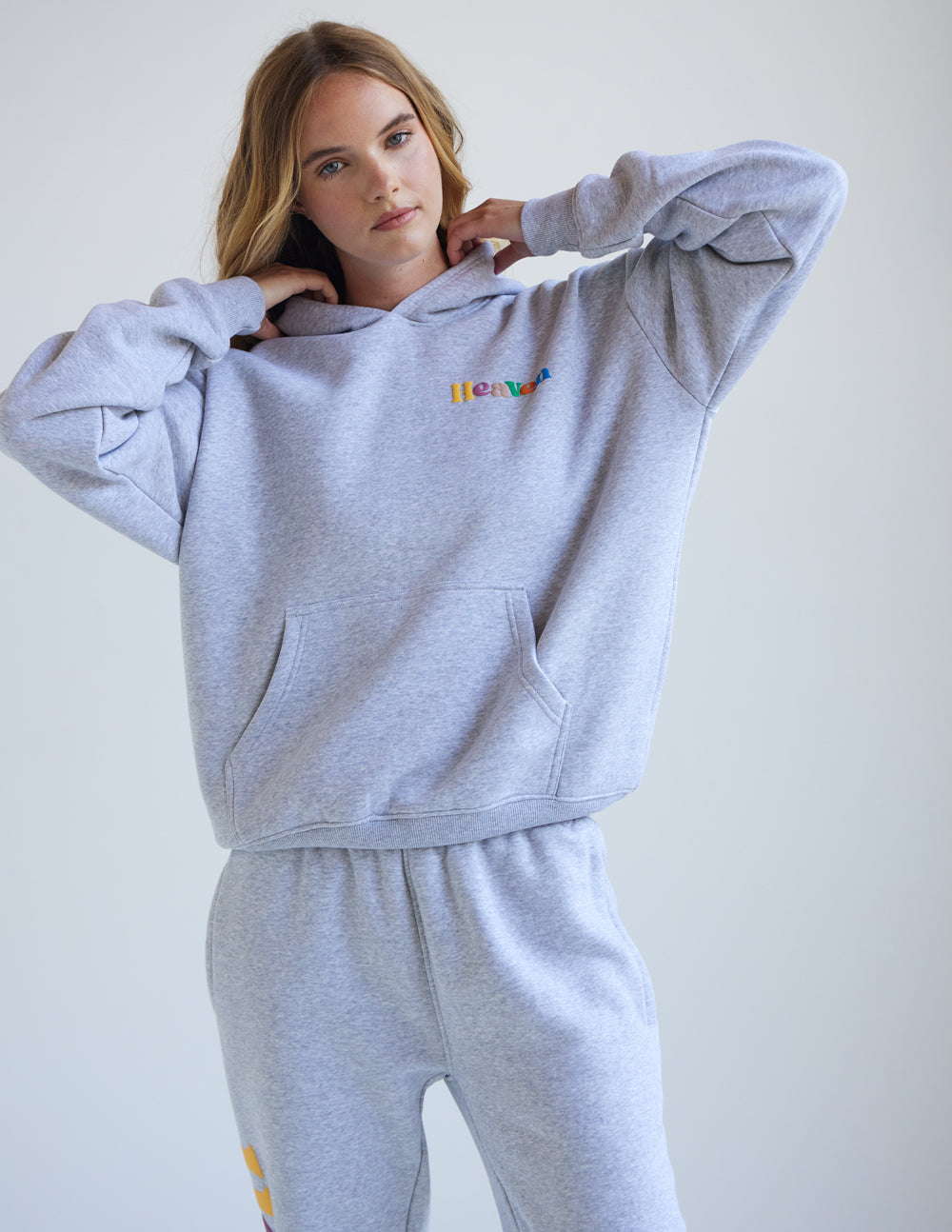 Heather grey unisex hoodie with hood, kangaroo pocket, and Heaven logo on front