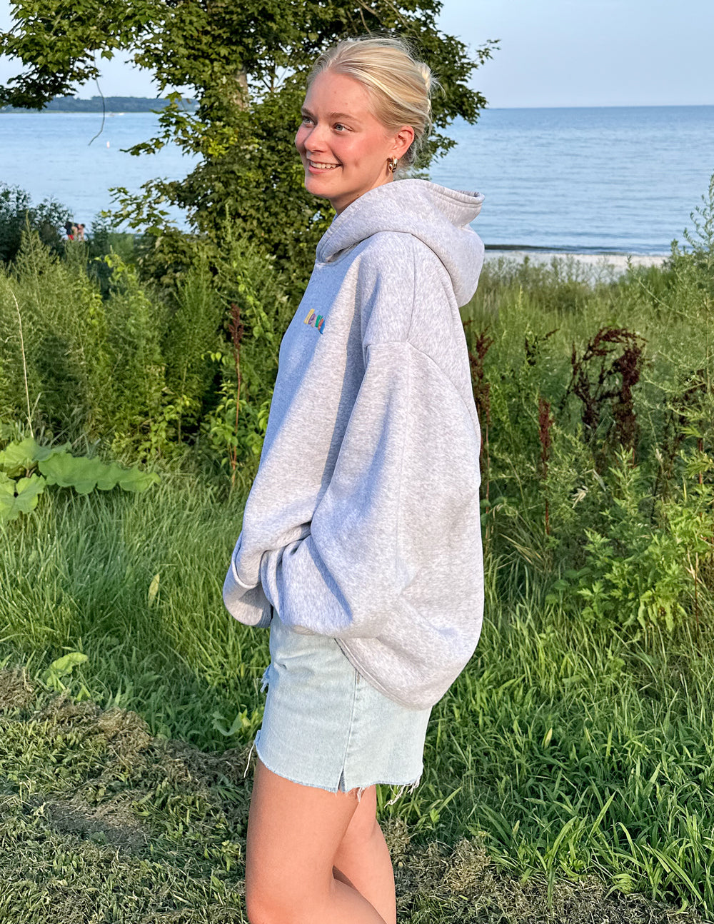 Heather grey unisex hoodie with hood and kangaroo pocket, Heaven logo visible on front