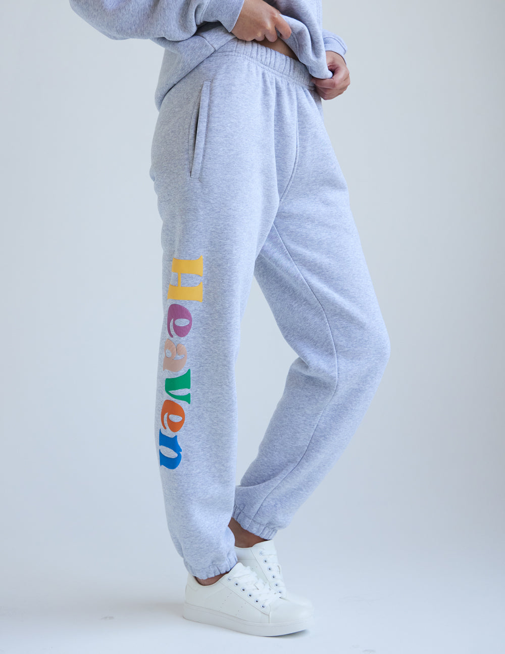 Heather grey unisex sweatpants with elastic waistband and multicolor logo on left leg