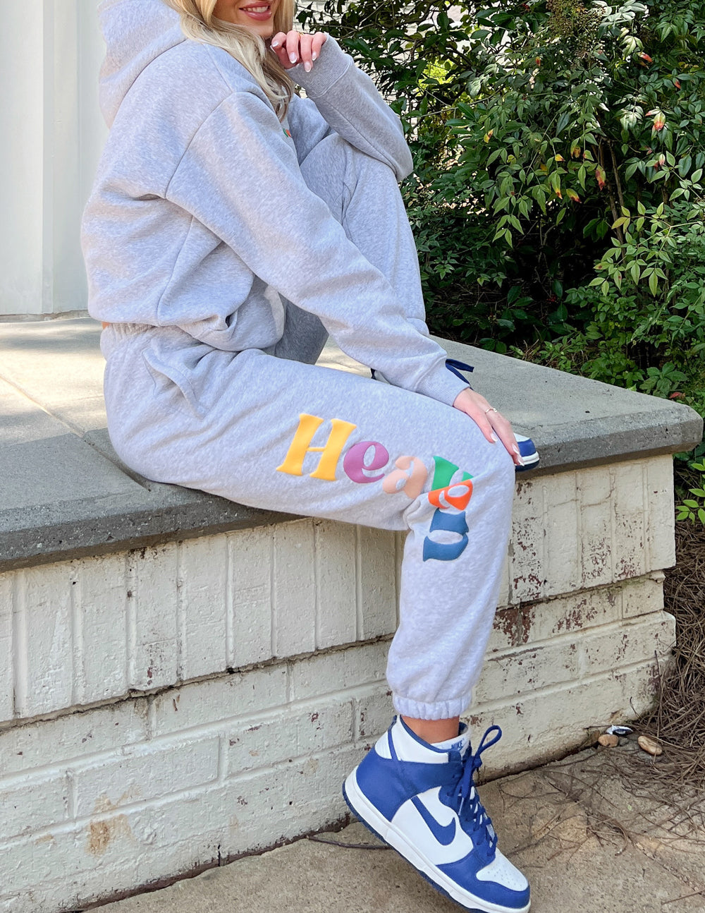 Heather grey unisex sweatpants with multicolor 'Heaven' graphic on left leg
