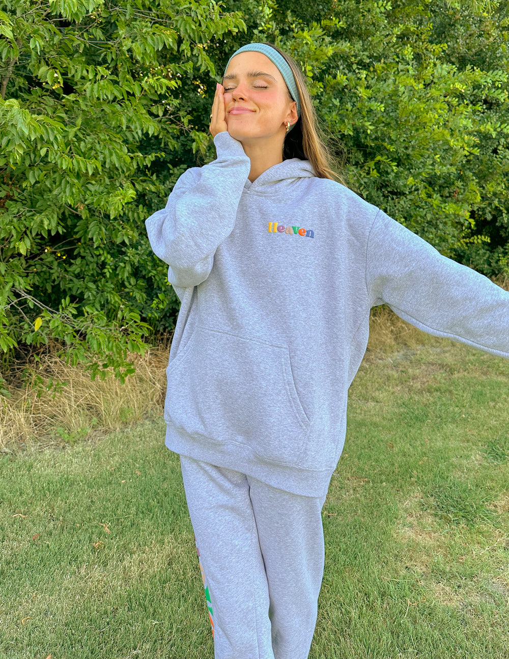 Heather grey unisex sweatpants with elastic waist and multicolor logo on leg