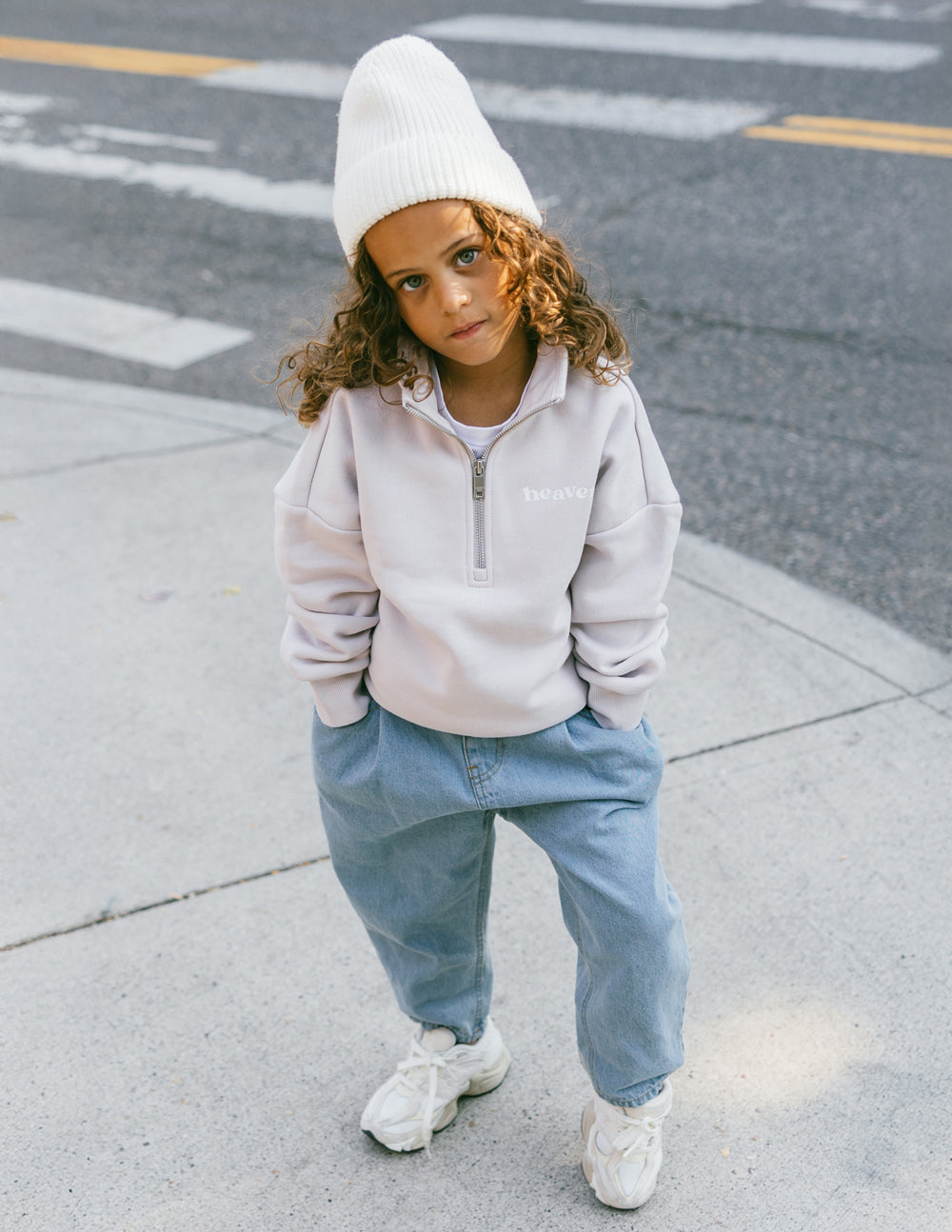 Kids half-zip sweatshirt in white, ribbed collar and cuffs with small chest logo