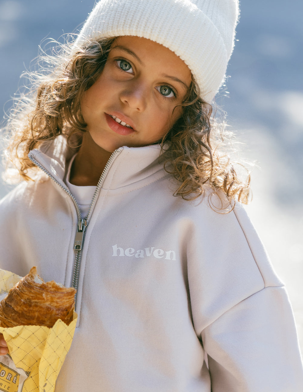 Kids half-zip sweatshirt in white with front zipper placket and chest logo