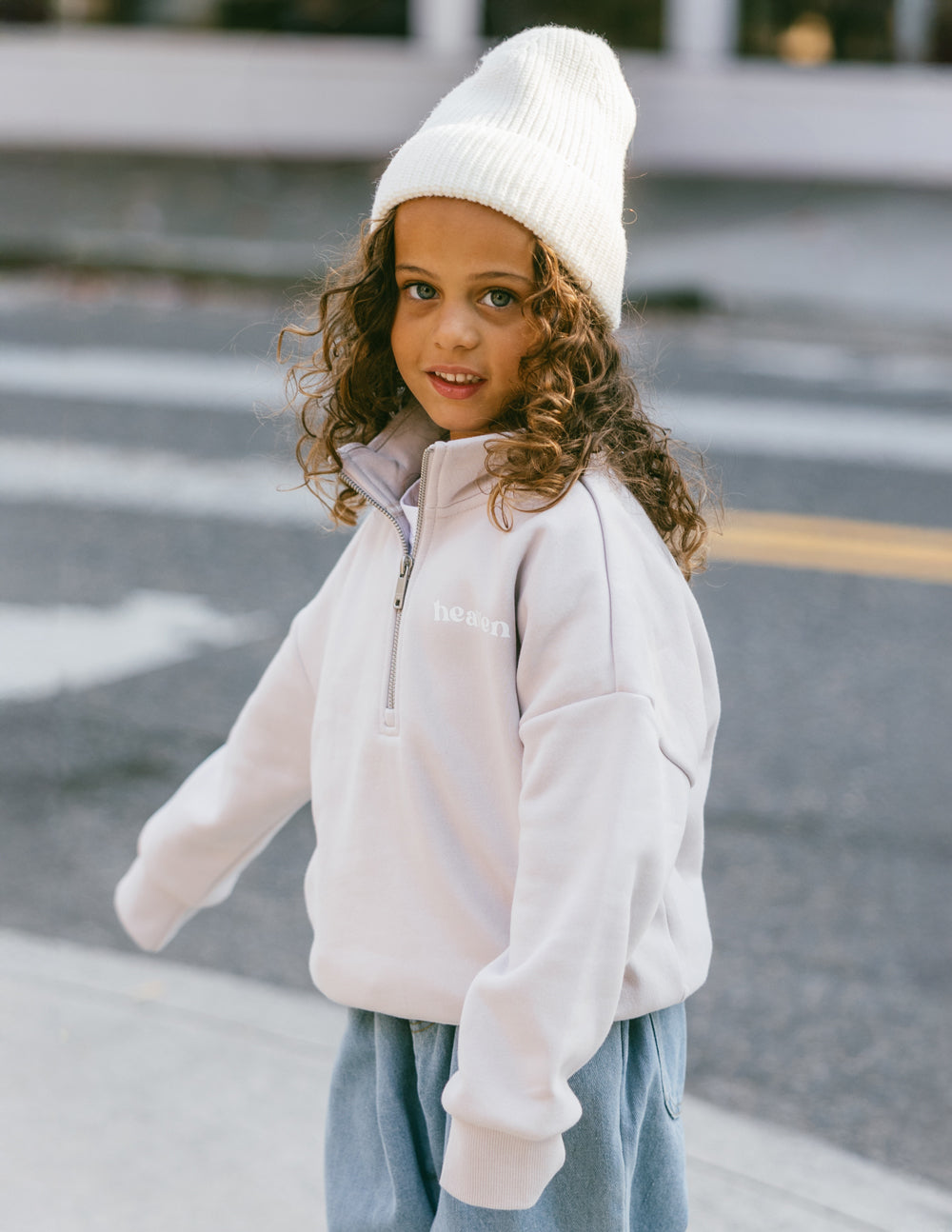 Kids half-zip sweatshirt in white with half-zip collar and small chest logo
