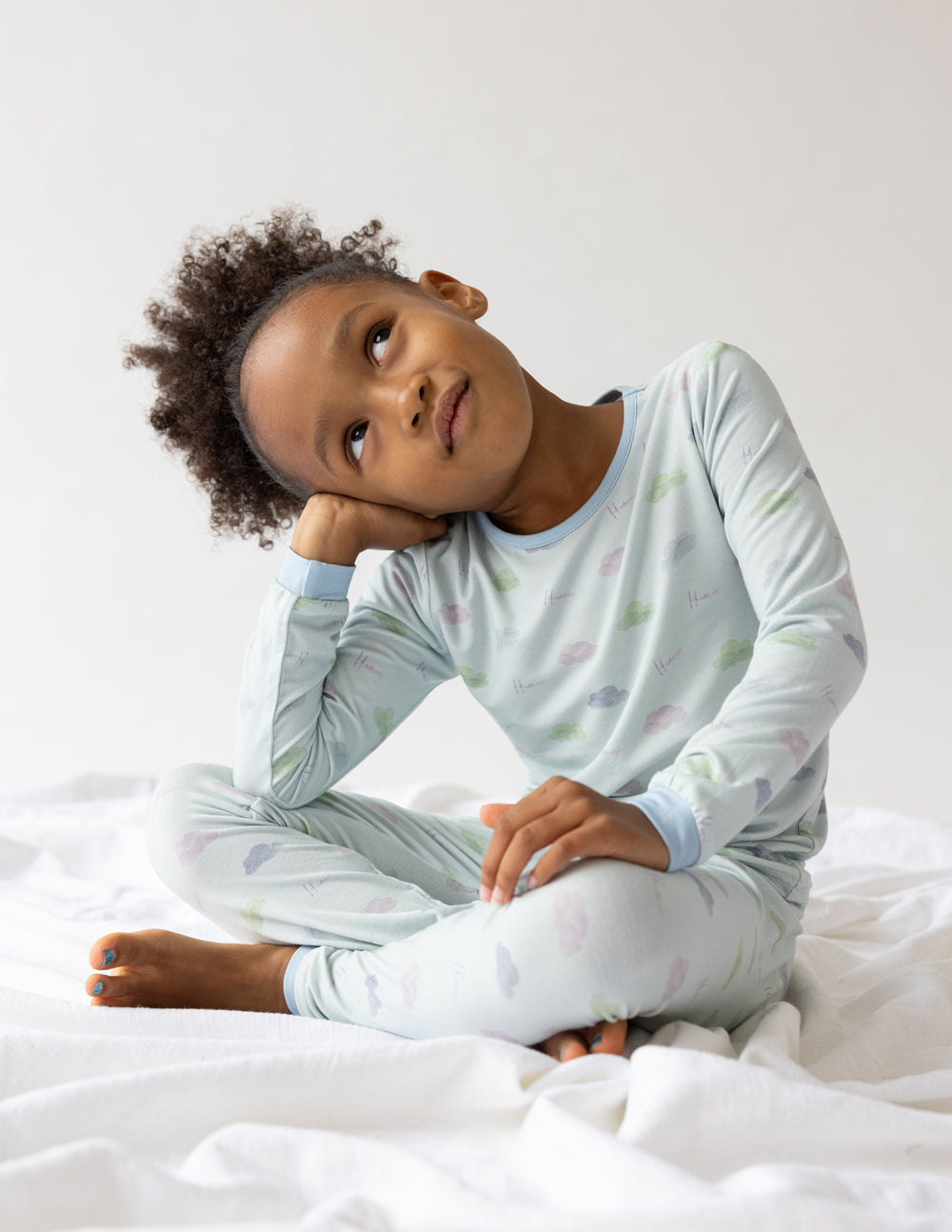 Kids pajama set, light blue long-sleeve top and pants with scattered colorful prints