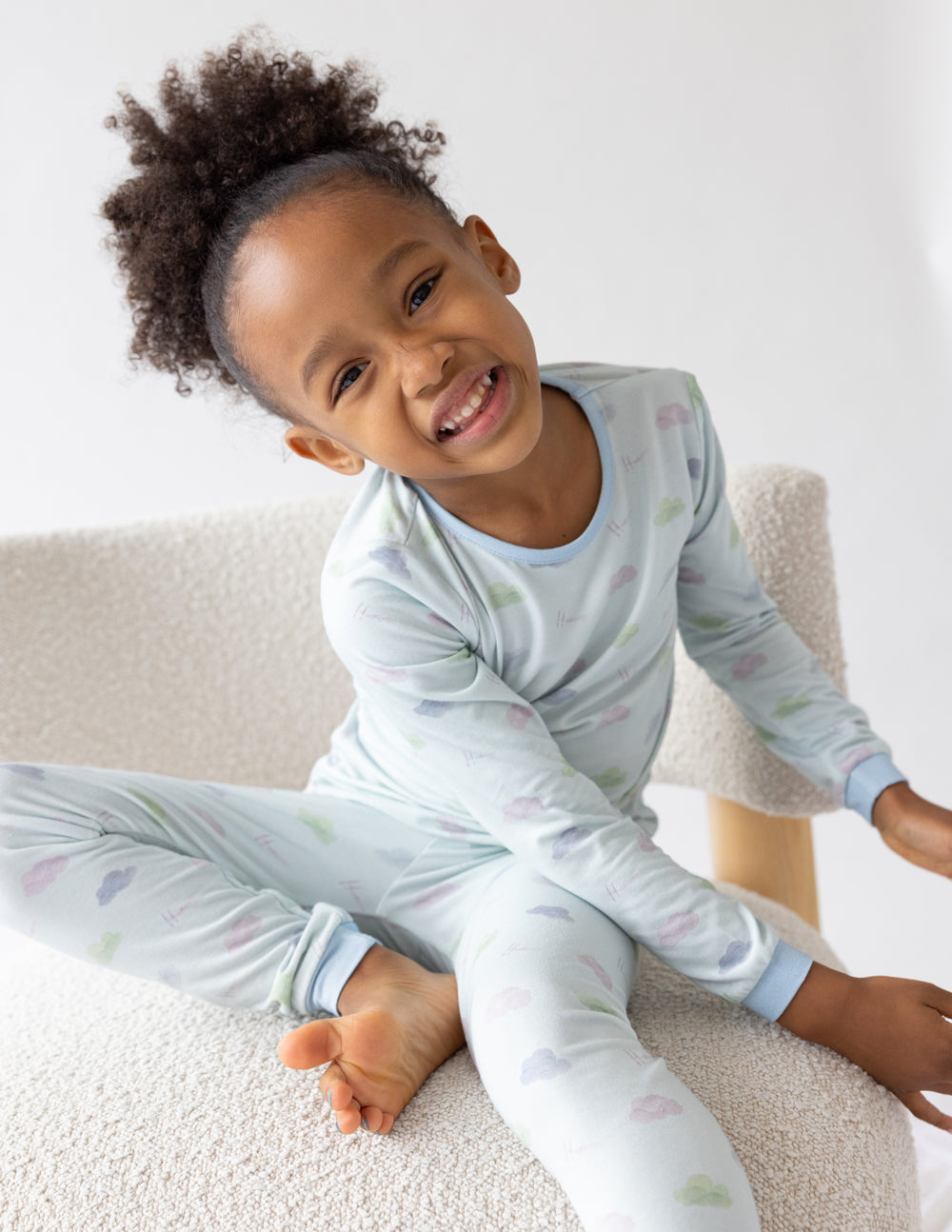Kids pajama set, light blue long-sleeve top and pants with colorful all-over print