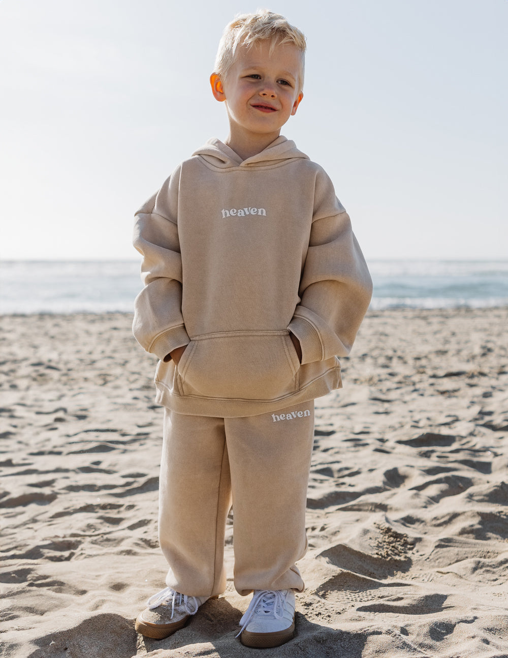 Kids beige sweatpants with 'heaven' logo print on the leg