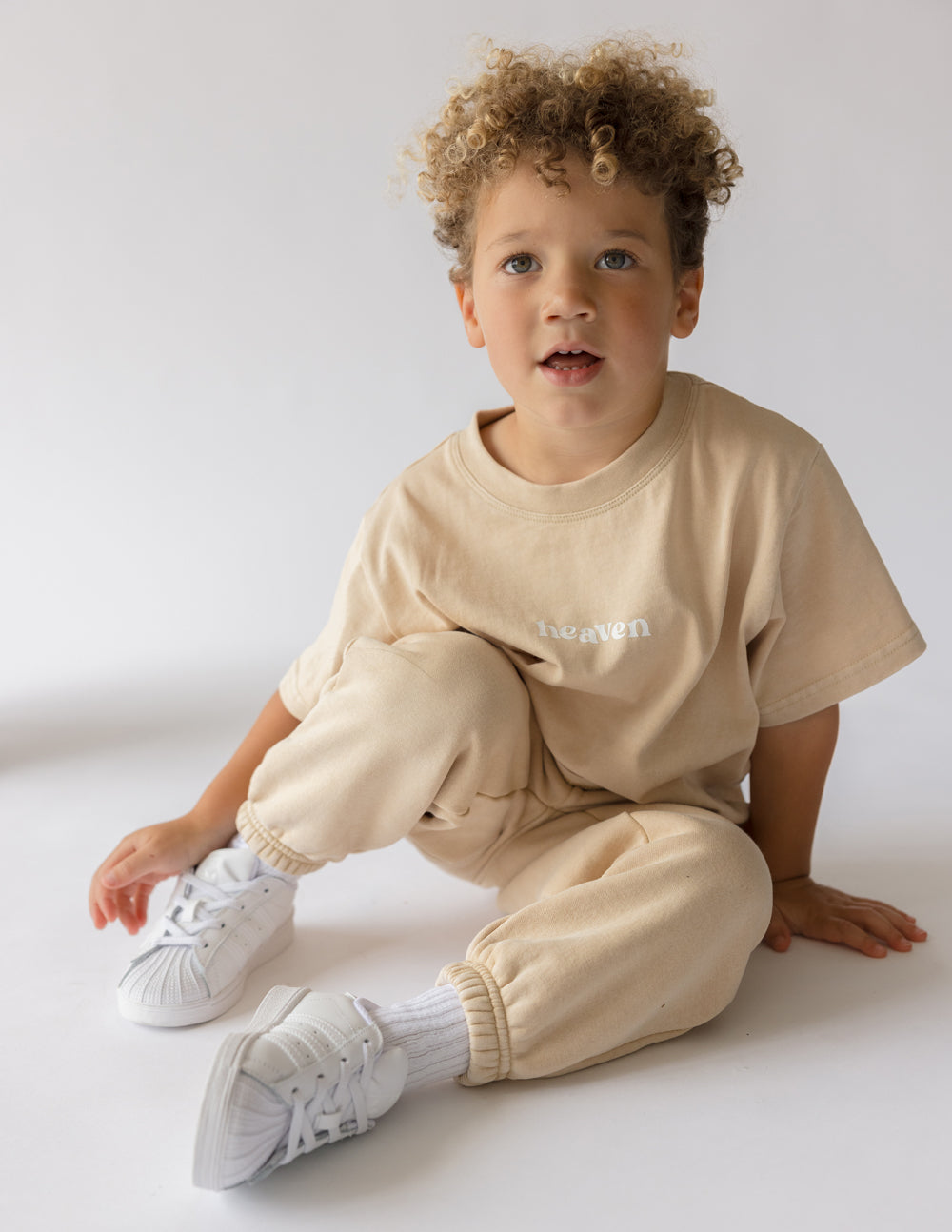 Kids tan T-shirt with small 'heaven' logo print on chest, crew neck, short sleeves