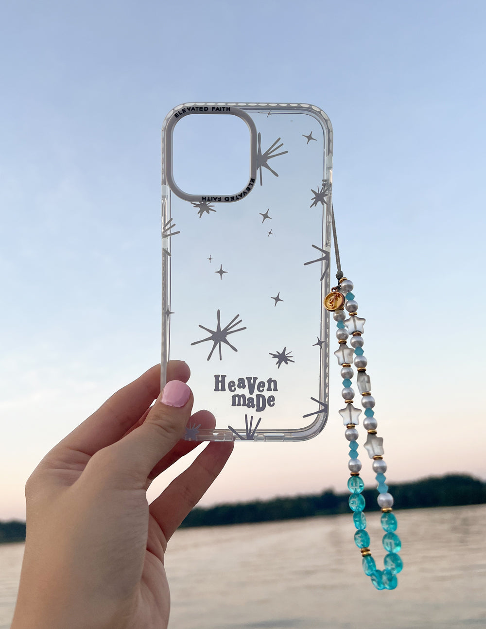Heaven Made phone case, transparent stars design with camera opening and beaded phone charm