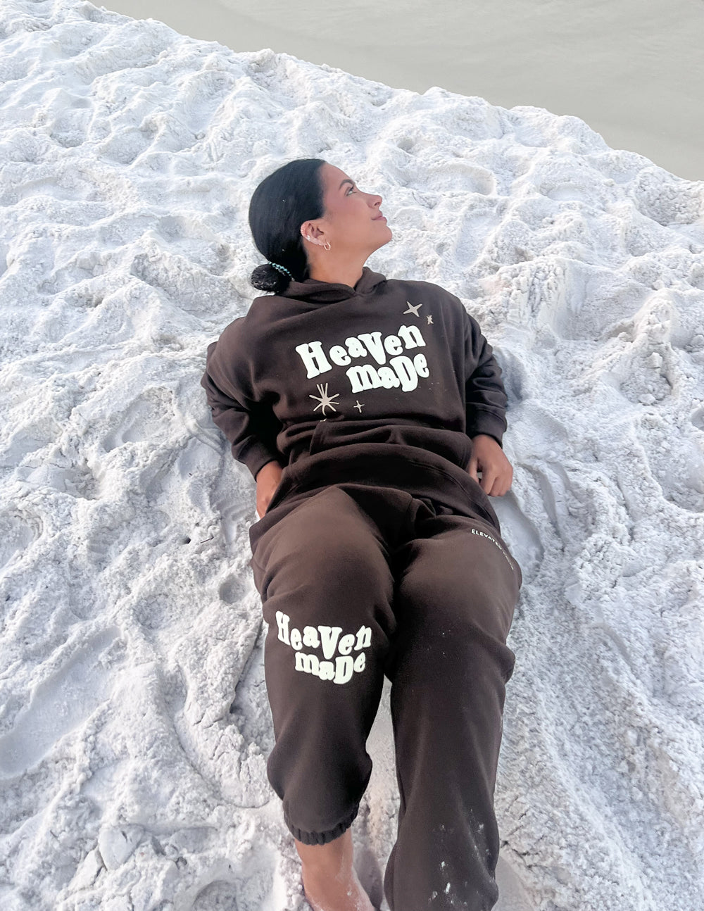 Unisex dark sweatpants with logo print on thigh and relaxed cuffed ankle