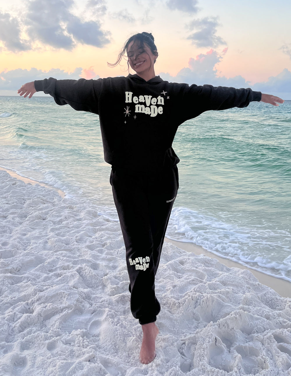 Unisex dark sweatpants with logo print on leg and tapered cuffed ankle