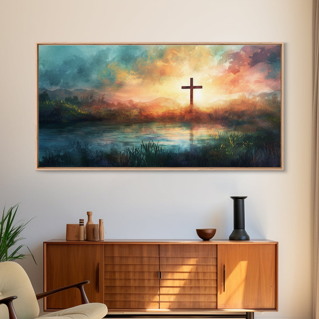 Landscape canvas wall art with cross above sunset lake, in light wood frame