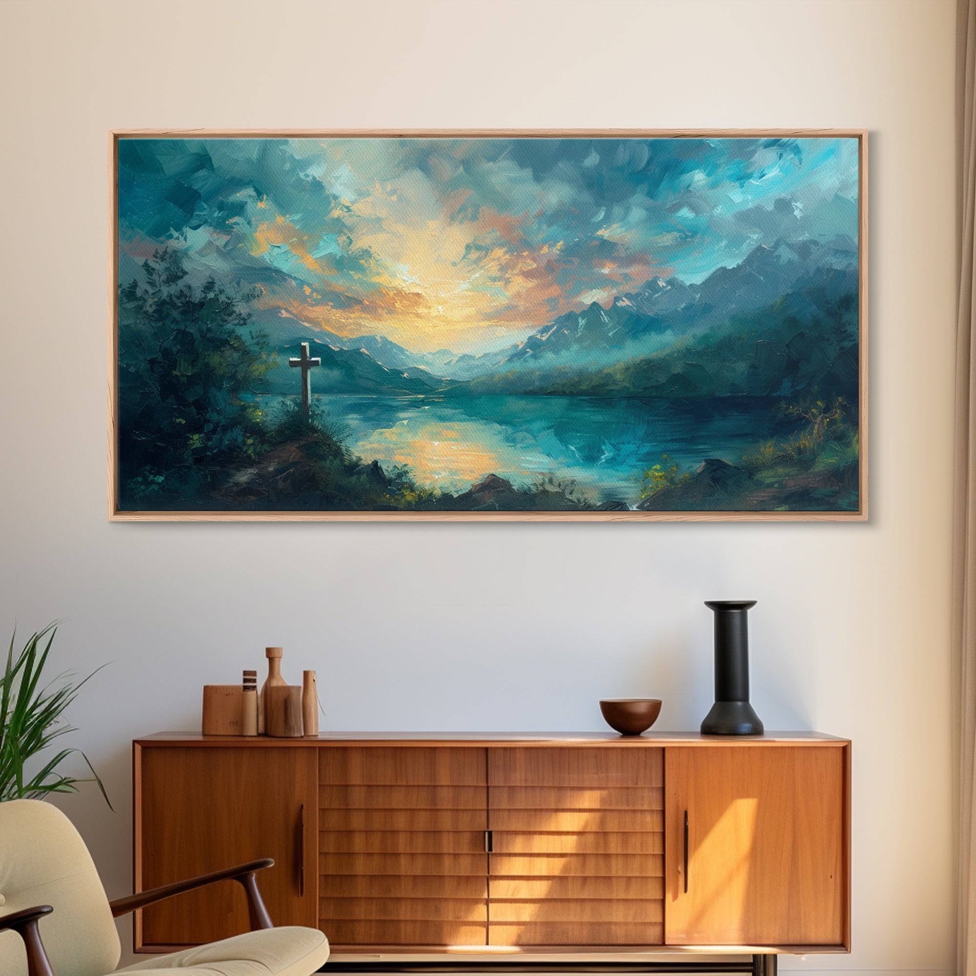 Framed canvas wall art with a cross and blue-green landscape under a golden sunset