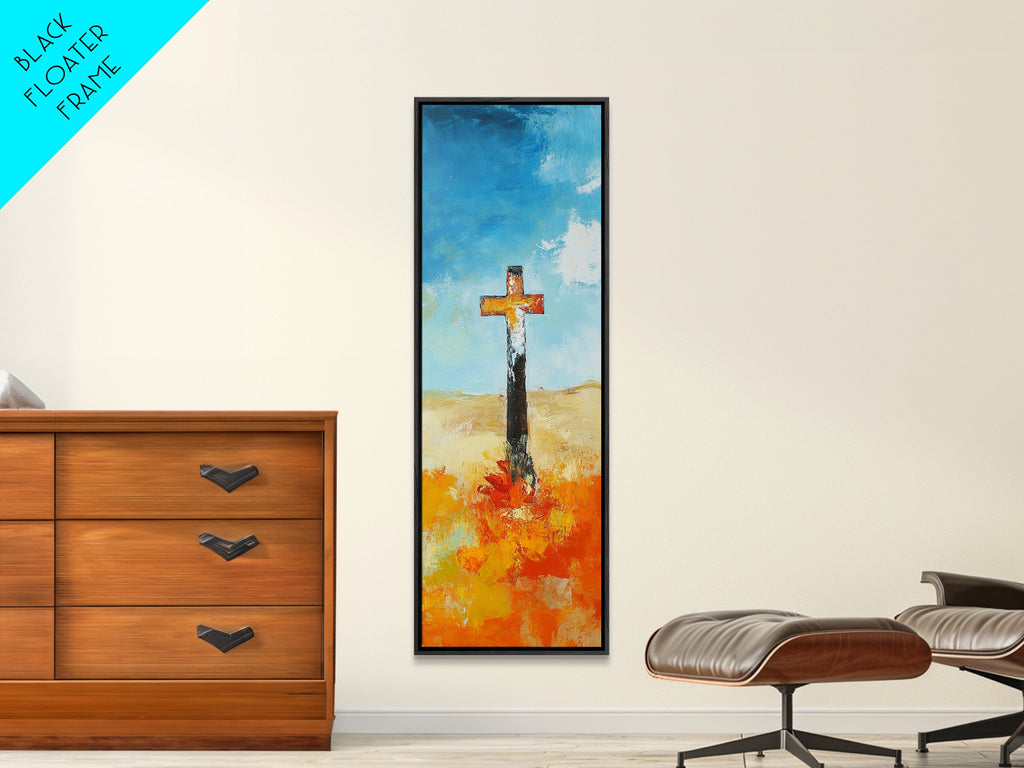 Framed canvas wall art with cross over blue sky and orange floral brushstrokes, dark frame