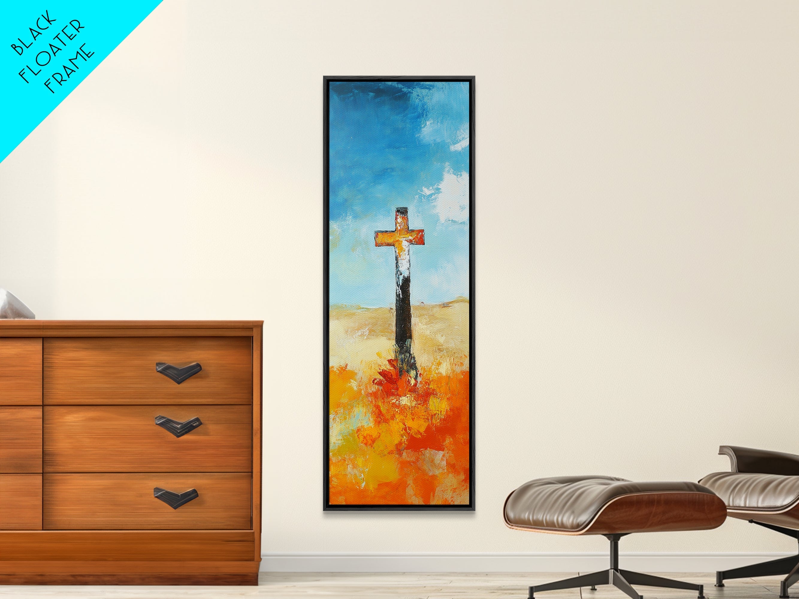 Framed canvas wall art with cross over blue sky and orange floral brushstrokes, dark frame