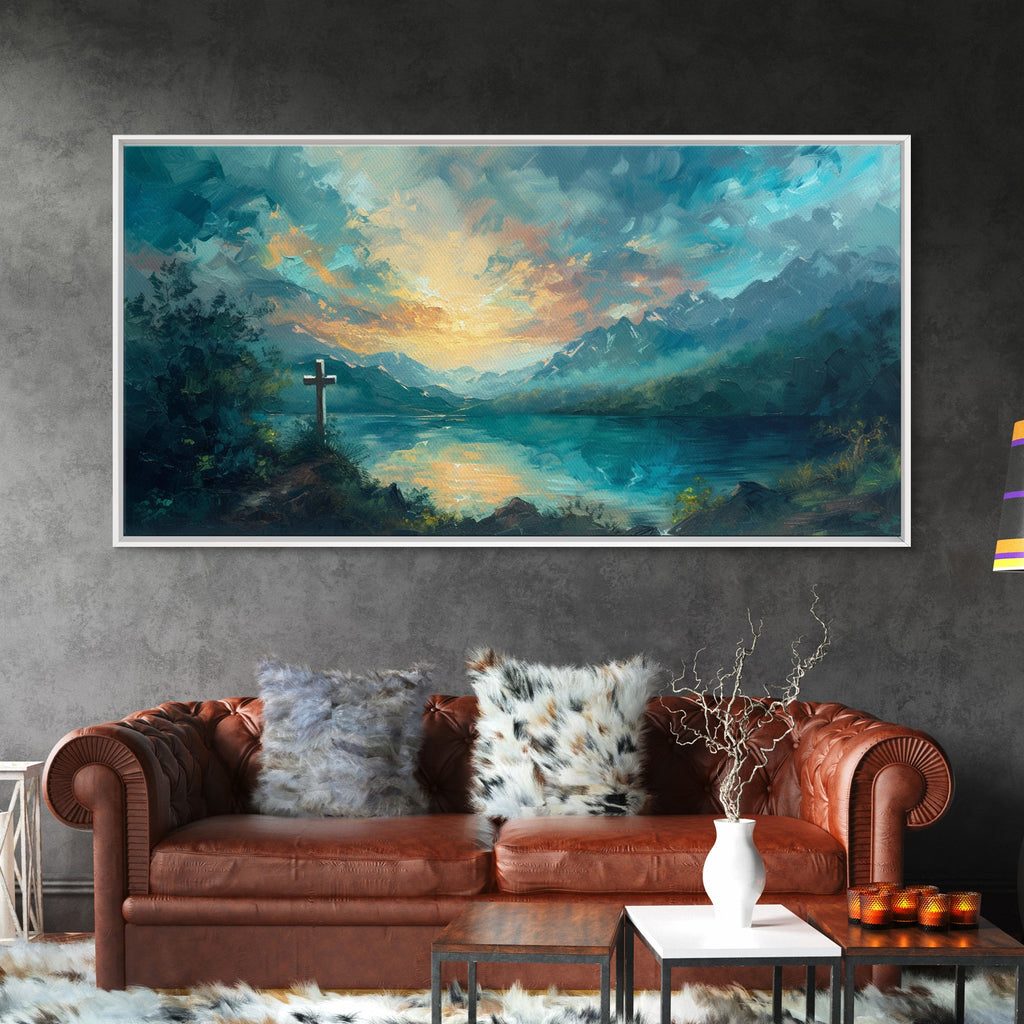 Framed canvas wall art featuring a cross silhouette over blue-green mountains and sunset sky