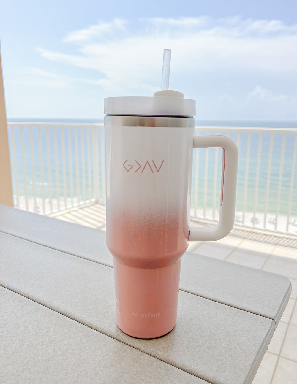 Insulated tumbler, pink-to-white ombre, silver lid, clear straw, side handle