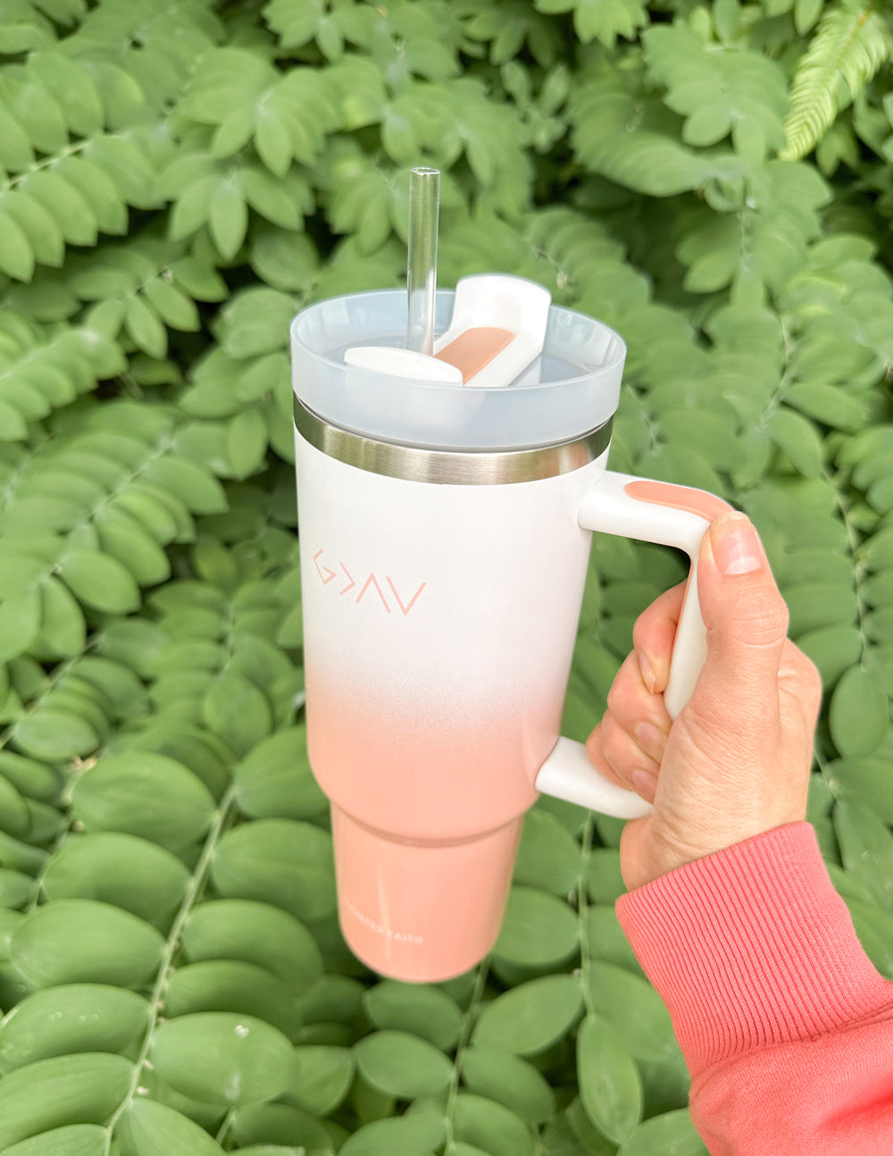 Insulated tumbler with clear straw, pink base, white body, silver lid, side handle
