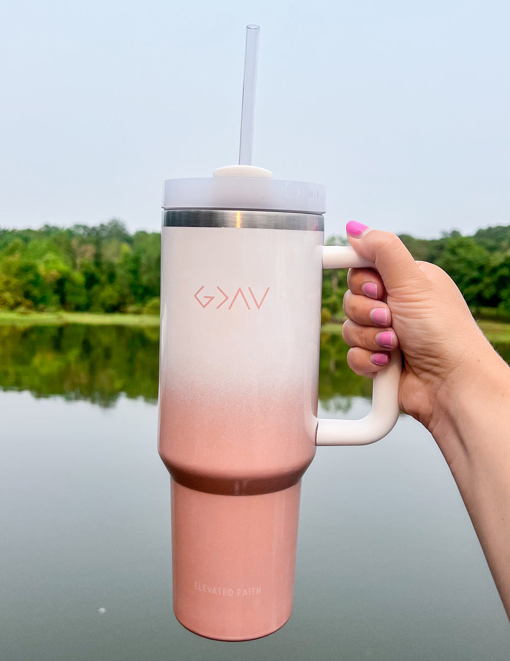 Insulated tumbler, pink ombre base, white body, silver lid, clear straw, side handle