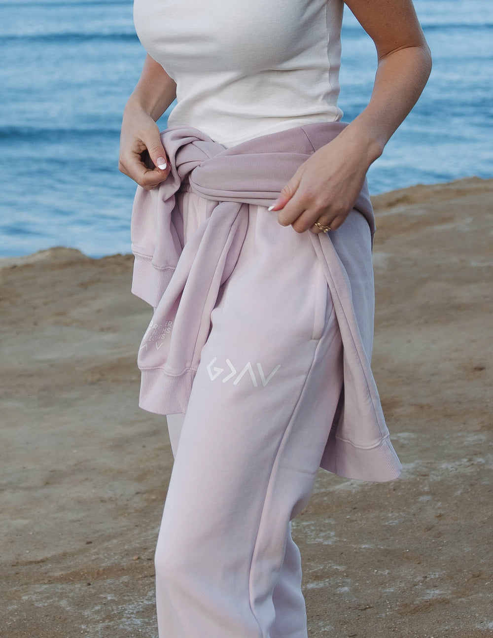 Light purple unisex sweatpants with drawstring waist and side logo