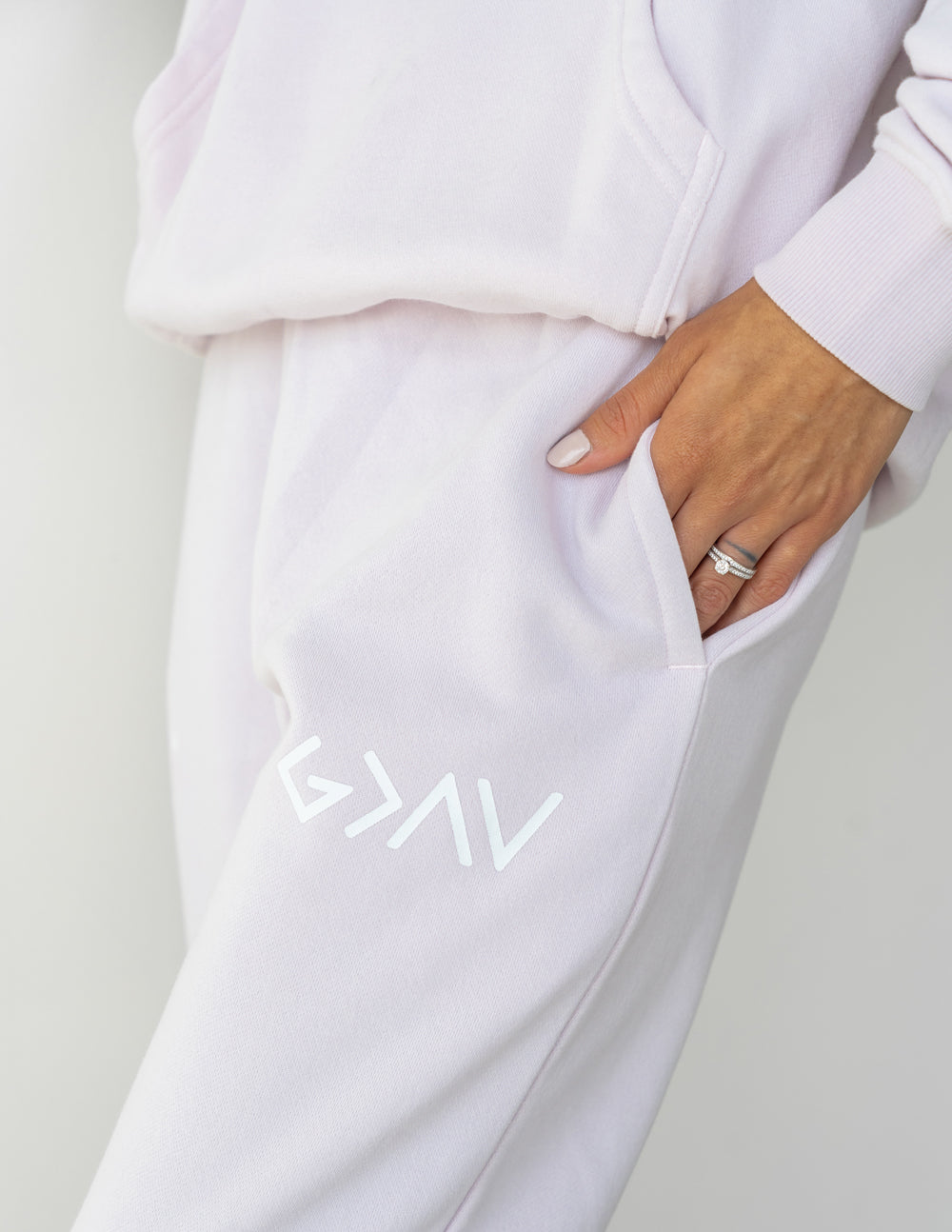Light purple unisex sweatpants with side pocket and leg logo